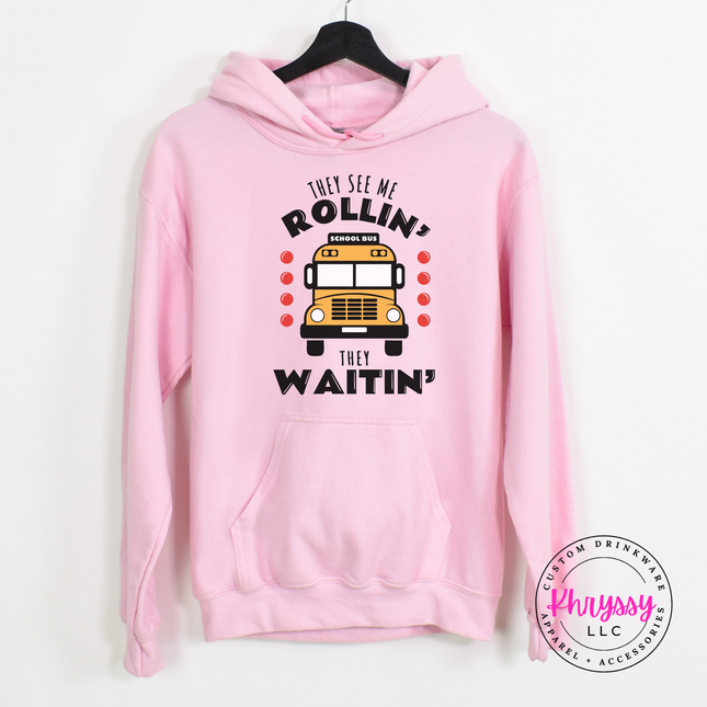 Light Pink hoodie featuring the bold They See Me Rollin bus print.