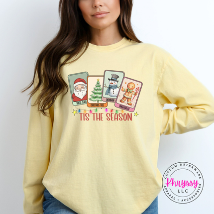 Woman wearing the Tis The Season Christmas card long sleeve tee in Butter.