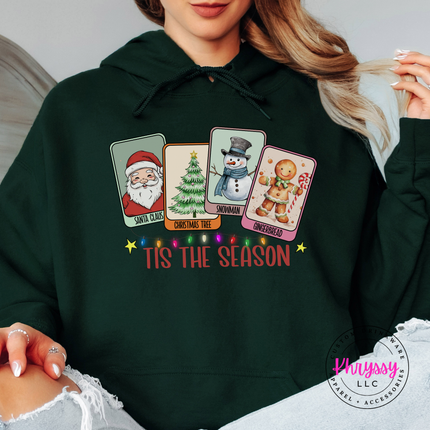 Woman wearing the Tis The Season Christmas card hoodie in Forest.