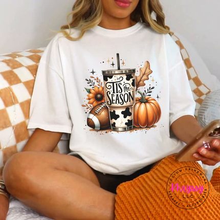 White tee with a hand-illustrated Tis The Season graphic print.