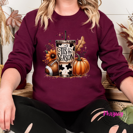 Maroon crewneck sweatshirt with the cow print tumbler football and pumpkin design