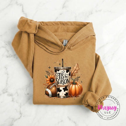 Old Gold colored hoodie featuring a cow print tumbler and sunflower.