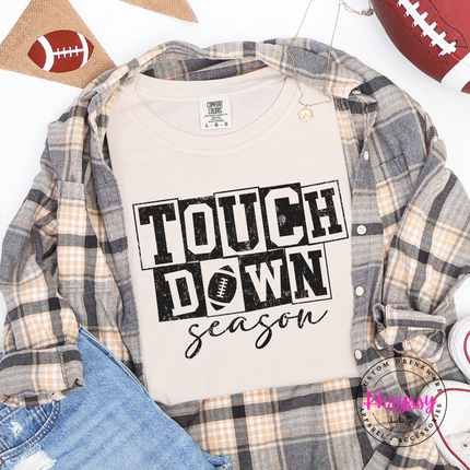 Ivory tee with the distressed touchdown season football design