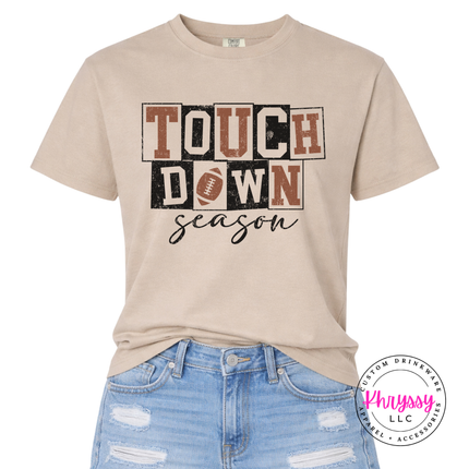 Sandstone tee with a bold touchdown season football illustration.