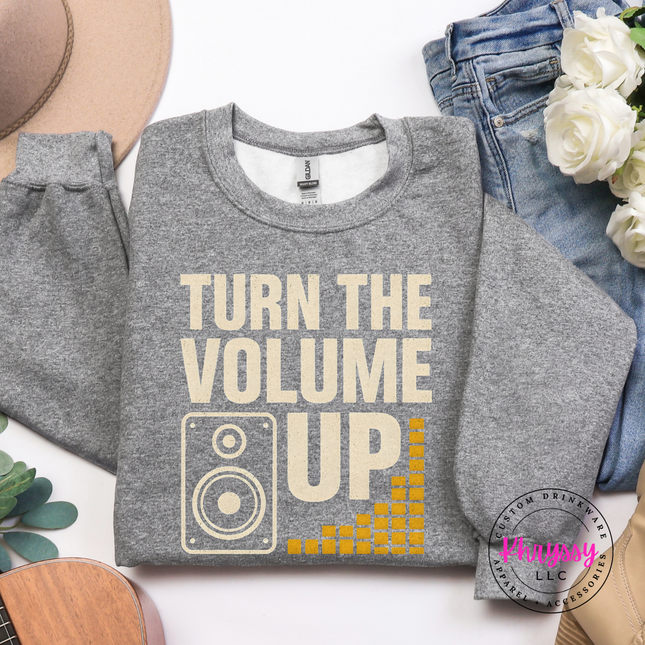 Thick warm bold statement crewneck with gold music volume lettering