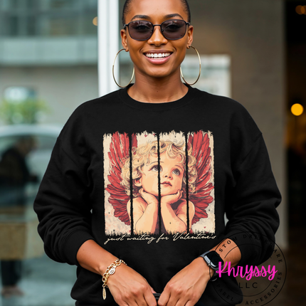 Close-up of an angel design on a black crewneck.