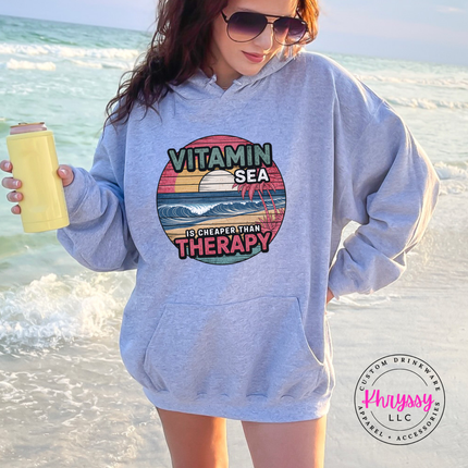 Ash gray beach hoodie with a vintage Vitamin Sea therapy graphic.