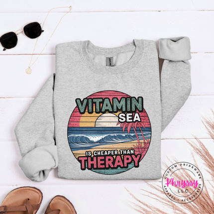 Ash gray beach crewneck with a vintage Vitamin Sea therapy graphic.