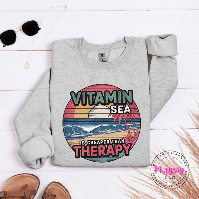 Ash gray beach crewneck with a vintage Vitamin Sea therapy graphic.