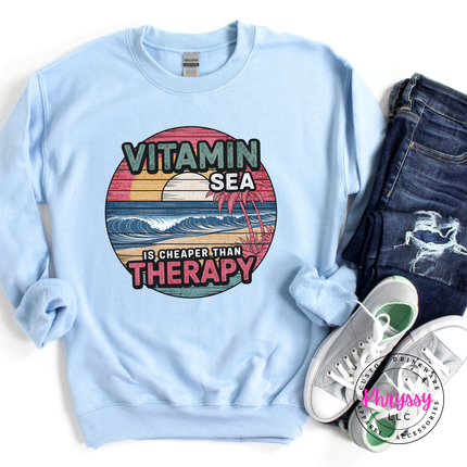 Light Blue beach crewneck with a vintage Vitamin Sea therapy graphic.