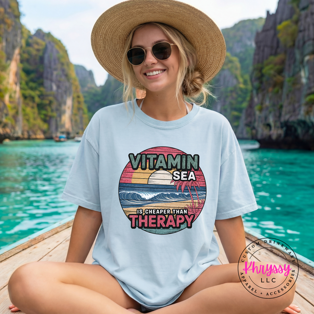 Chambray blue Comfort Colors tee showing a retro beach therapy design.
