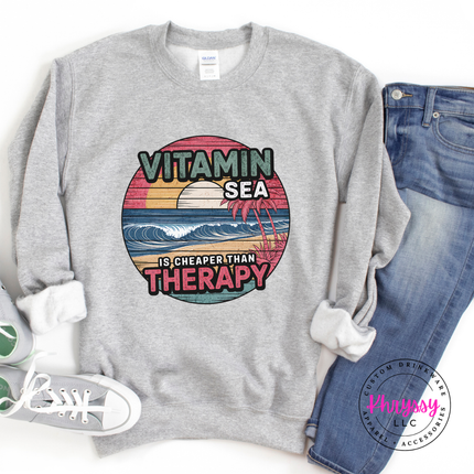 Sport grey sweatshirt showing a distressed retro ocean beach scene.