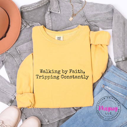 Mustard long sleeve tee with the relatable walking by faith Christian graphic