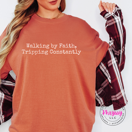 Terracotta long sleeve tee with the Walking By Faith, Tripping Constantly quote