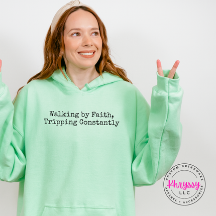 Mint Green hoodie with the relatable walking by faith Christian graphic