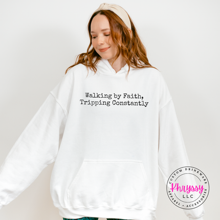 White hoodie with the relatable walking by faith Christian graphic