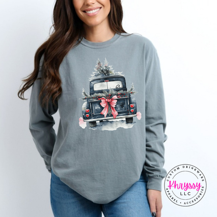Gray long sleeve tee showing a truck tied with a big bow and garland.