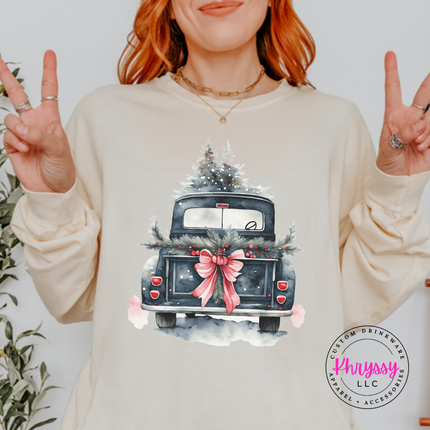 Ivory long sleeve tee featuring a watercolor vintage truck with snowy trees.