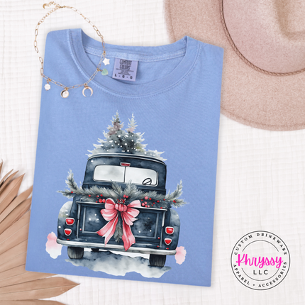 Washed Denim long sleeve tee showing a truck tied with a big bow and garland.