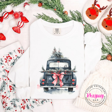 Flat lay of the watercolor Christmas truck Christmas long sleeve tee in White.