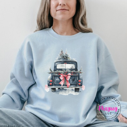 Light Blue crewneck sweatshirt showing a truck tied with a big bow and garland.