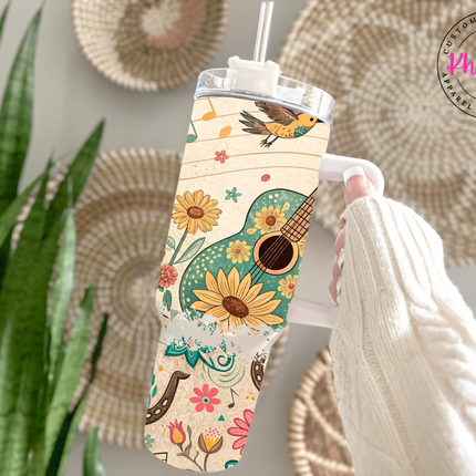 Country music themed tumbler with western elements.