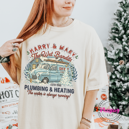Ivory Comfort Colors tee showing a vintage van, cozy cabin, and a funny plumbing tagline.