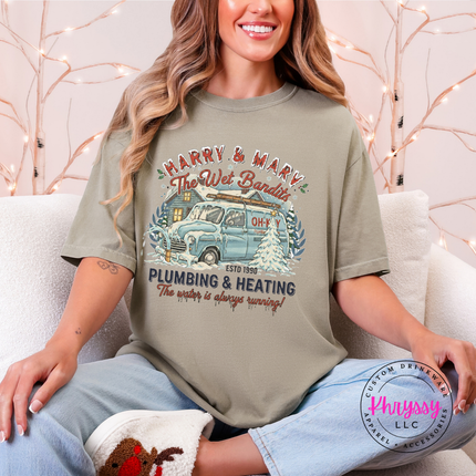 Relaxed Khaki Comfort Colors tee with a nostalgic Christmas plumbing badge, front view.