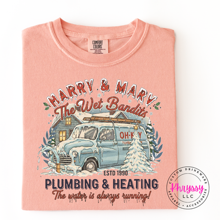 Peachy Comfort Colors tee with a retro snowy van badge and a funny holiday tagline.