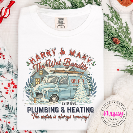 White Comfort Colors tee featuring a retro plumbing and heating Christmas badge, front view.
