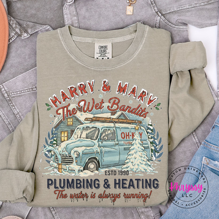 Roomy Khaki long sleeve tee with a nostalgic Christmas plumbing badge, front view.