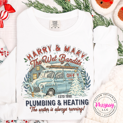 White long sleeve tee featuring a retro plumbing and heating Christmas badge, front view.