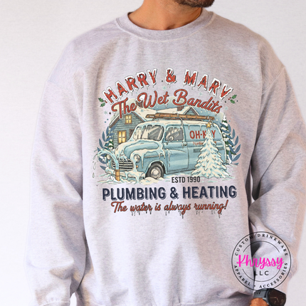 Ash crewneck sweatshirt with a retro plumbing and heating badge and snowy van.