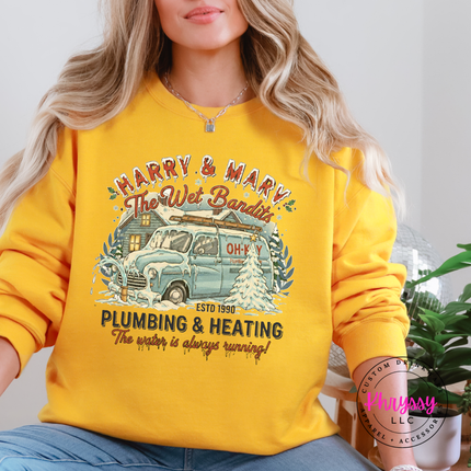 Close up of a snow covered vintage van illustration on a Gold crewneck sweatshirt.
