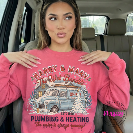 Safety Pink crewneck sweatshirt featuring a snowy cabin and van in a retro holiday badge.