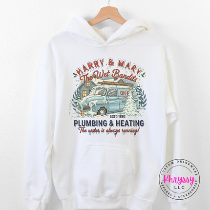 White pullover hoodie featuring a retro plumbing and heating Christmas badge, front view.