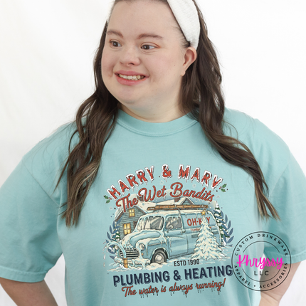 Chalky Mint Comfort Colors tee styled with jeans, showing the full retro Christmas badge.