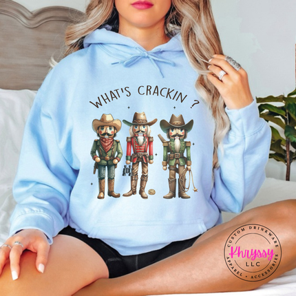 Light Blue hoodie showing cowboy nutcrackers in hats and boots.