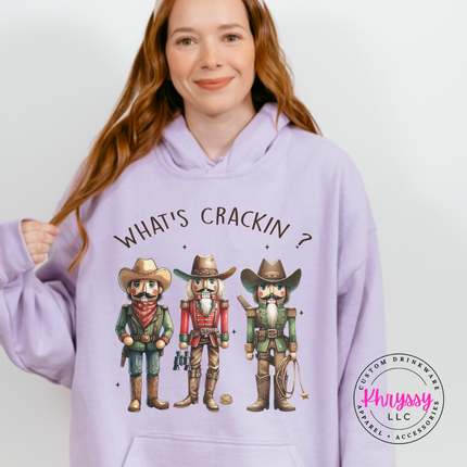 Orchid hoodie featuring three cowboy nutcrackers and What's Crackin lettering.