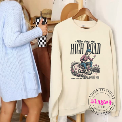 Beige sweatshirt with graphic design and text, displayed on a hanger.