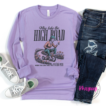 Purple long-sleeve shirt with graphic design and jeans on a white background
