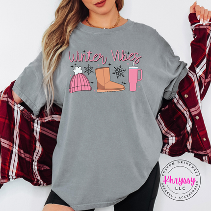 Close up of the Winter Vibes script and snowflakes on a Gray tee.