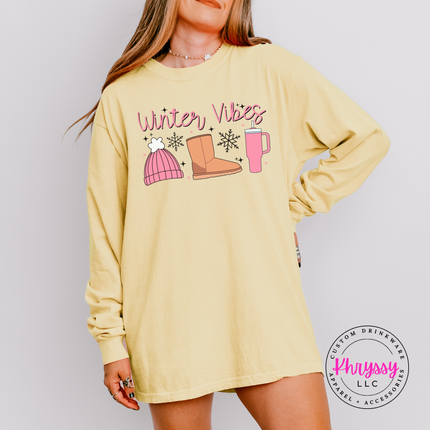Butter long sleeve tee with Winter Vibes script, beanie, boot and tumbler.