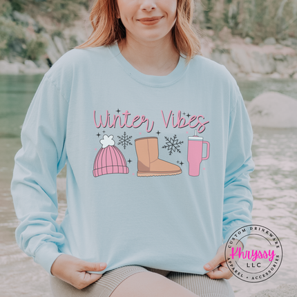 Woman wearing the Winter Vibes long sleeve tee in Chambray.