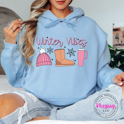 Light Blue hoodie featuring winter essentials with snowflakes and sparkles.
