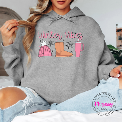 Cozy Winter Vibes beanie, boot and tumbler design on a Sport Grey hoodie.