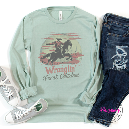 Heather dusty blue tee with a vintage Wranglin Feral Children design.