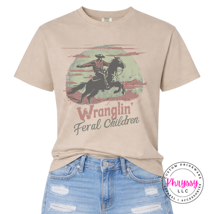 Sandstone tee showing a muted vintage cowboy mom graphic.