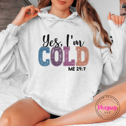 Model wearing the Yes I'm Cold hoodie in White.
