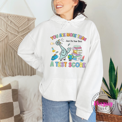 Scores Don't Define Them — Gildan Motivational Teacher Hoodie